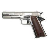 Blank-firing pistol with wooden grips and shiny chrome finish on a white background.