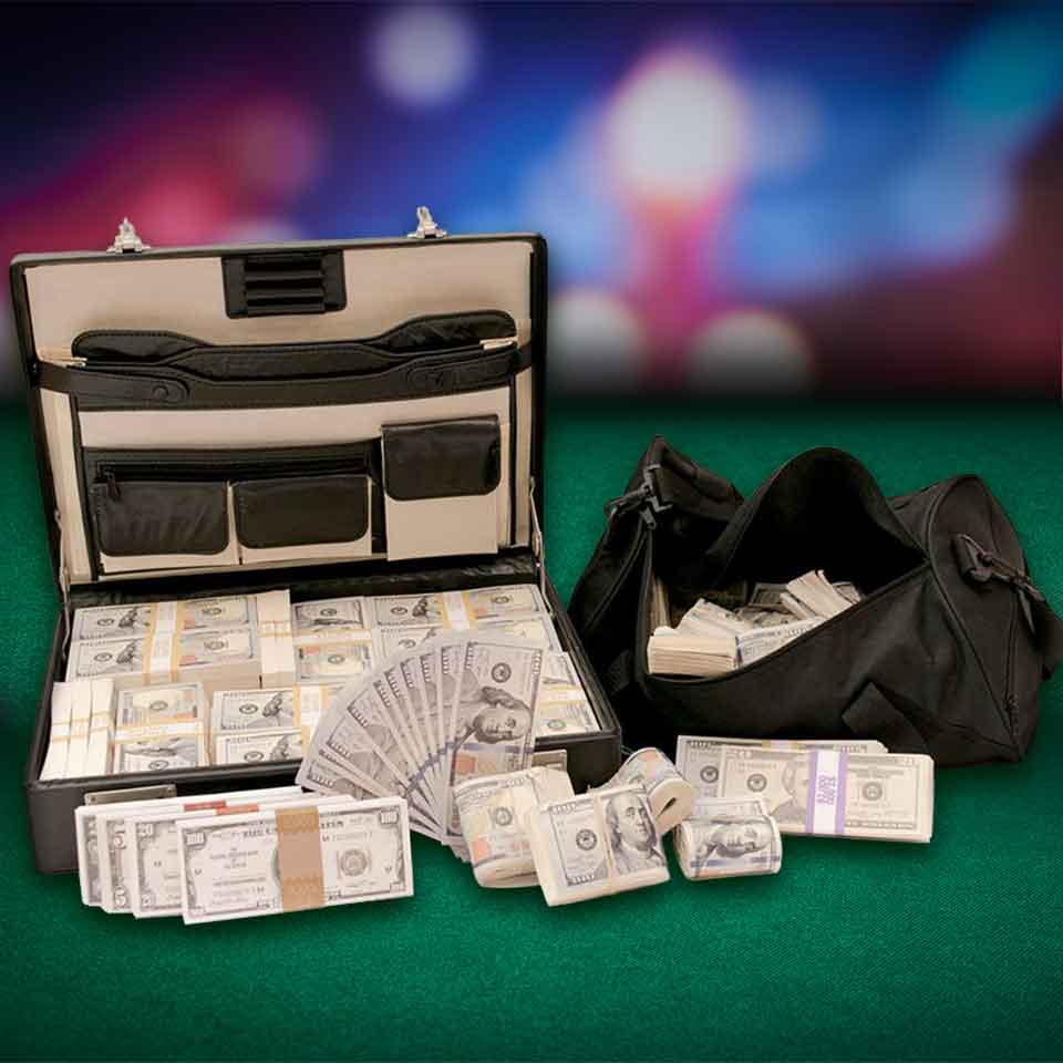 Briefcase and duffel bag full of prop movie money on casino table - category image.