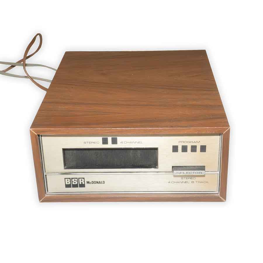 Vintage wooden radio with BSR McDonald branding on a white background