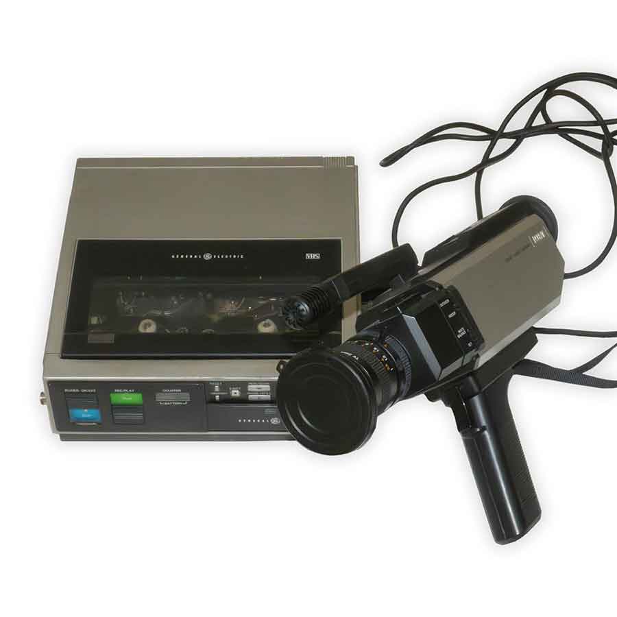 Vintage video camera and tape recorder on a white background