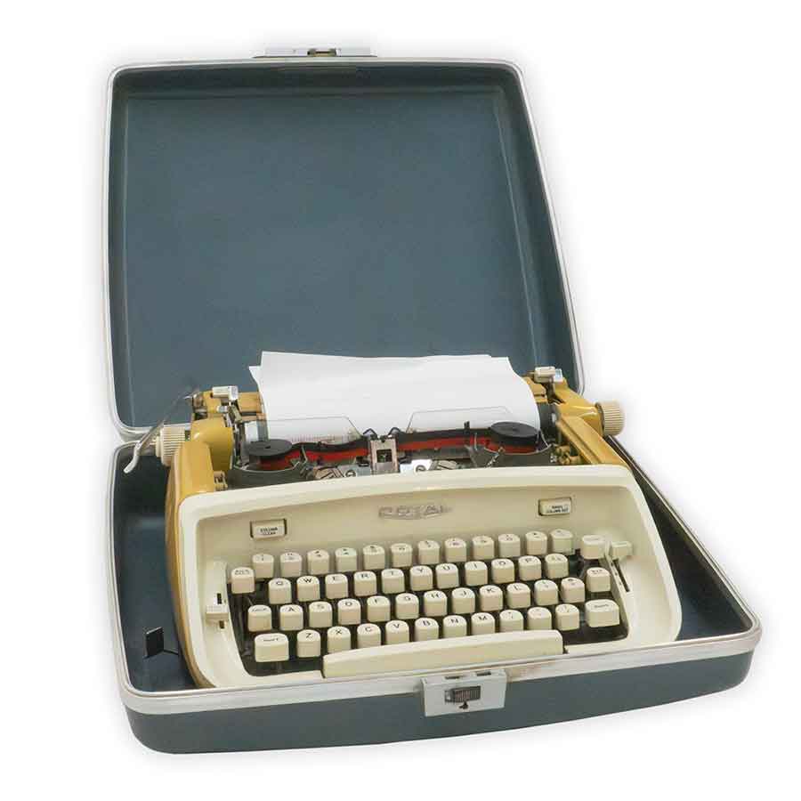 Vintage typewriter with a piece of paper inside, placed on a white background