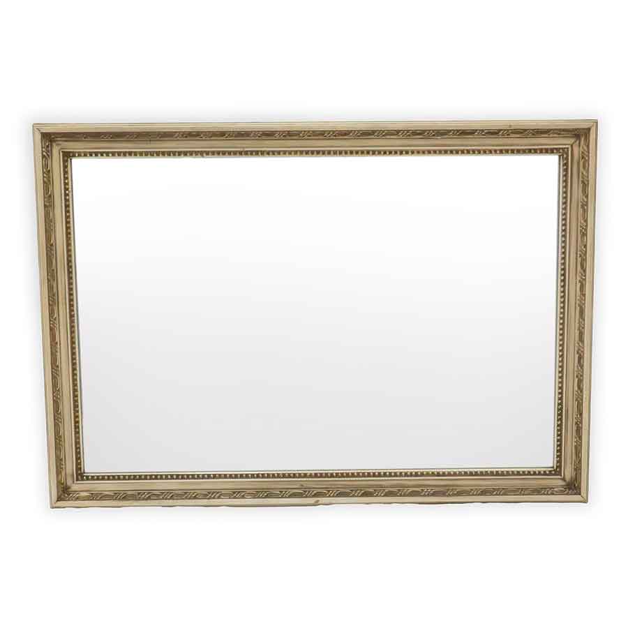 Decorative gold mirror on a white background