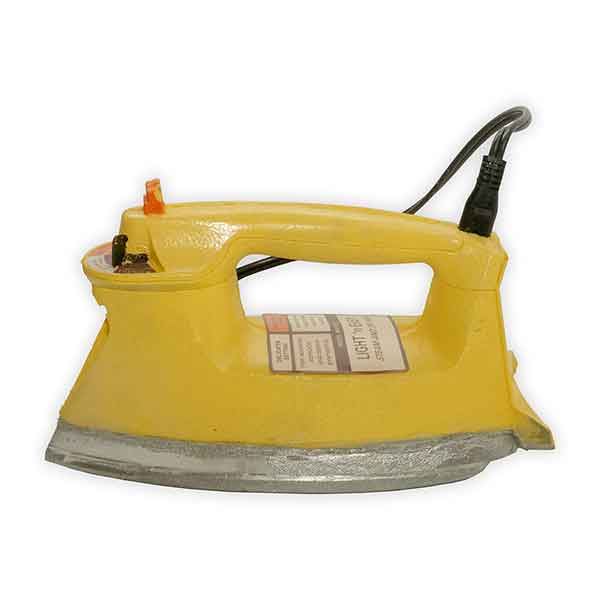 Yellow foam clothing iron on a white background.