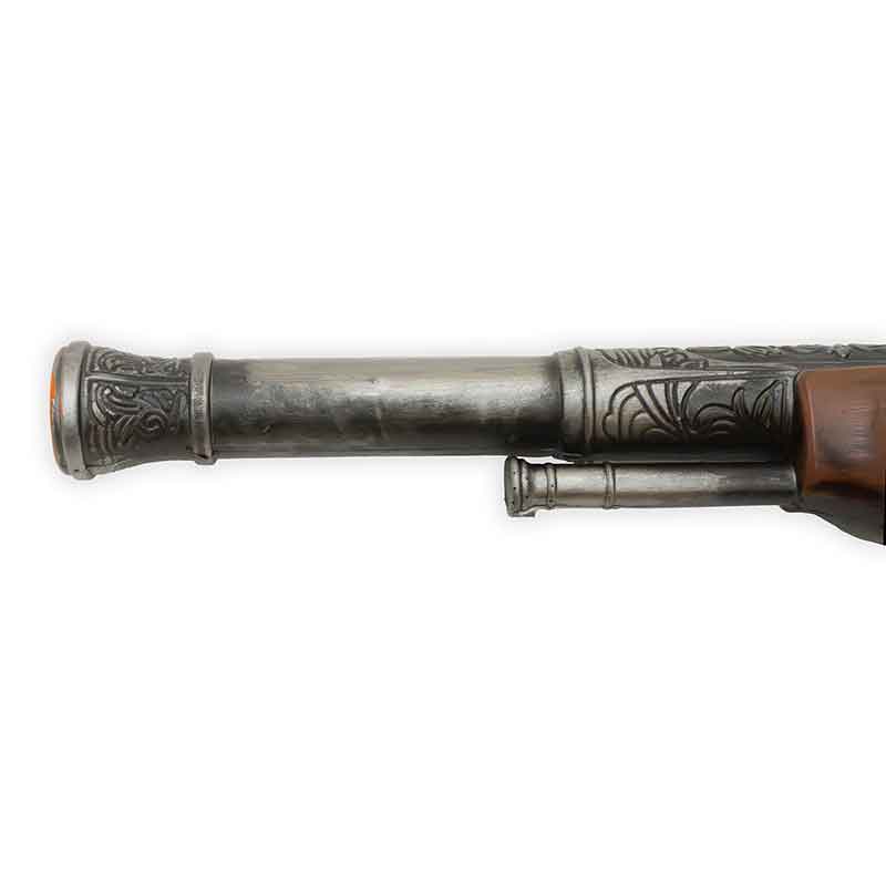 Decorative rifle barrel with intricate engravings on a white background