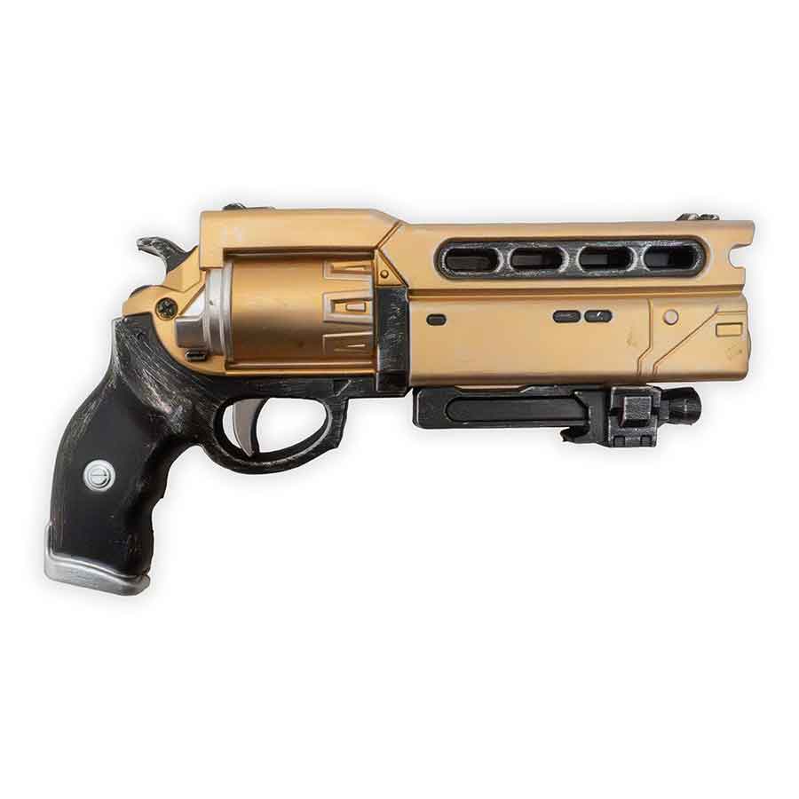 Gold and black futuristic revolver on a white background