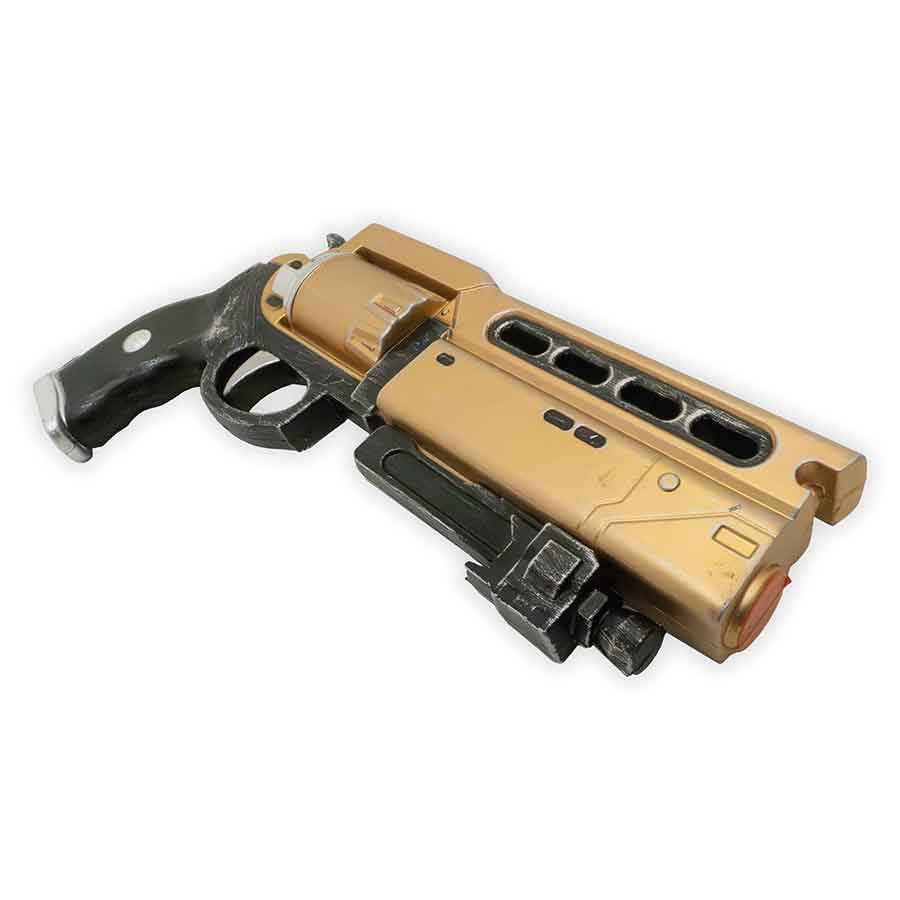 Toy gun with a gold and black design on a white background