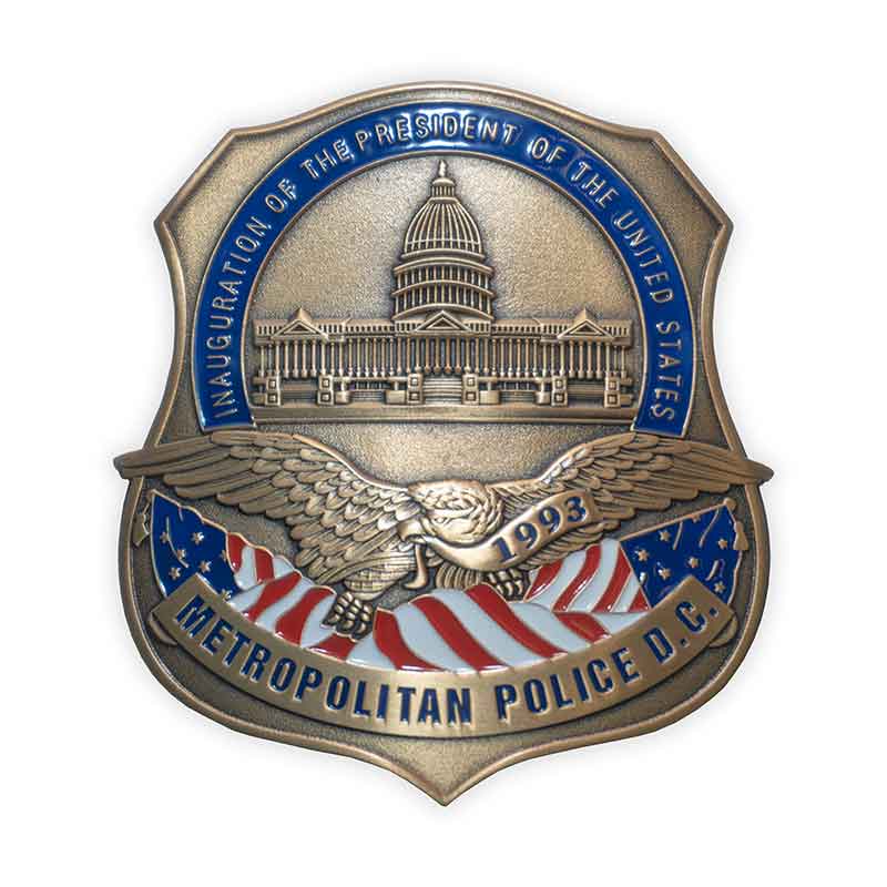 Metropolitan Police D.C. badge with eagle, American flag, and Capitol building.