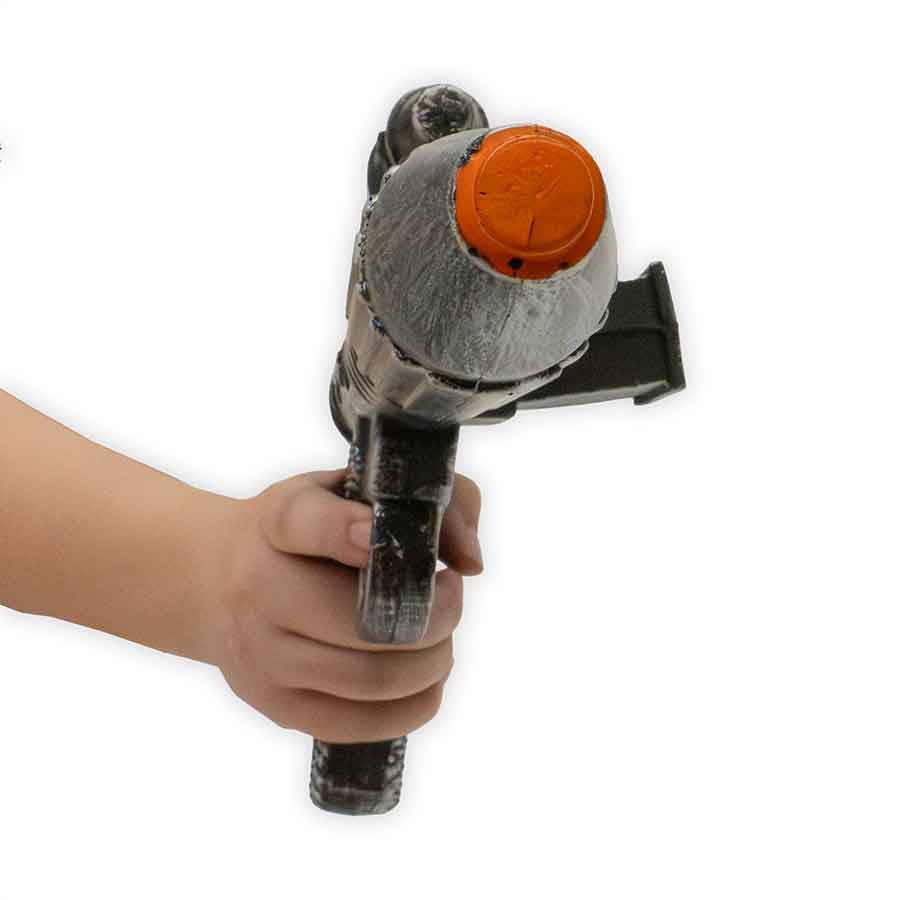 Hand holding a tool with an orange cap on a white background